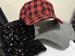 Set of 3 baseball caps with red/black plaid, black/white, and black sequin. New