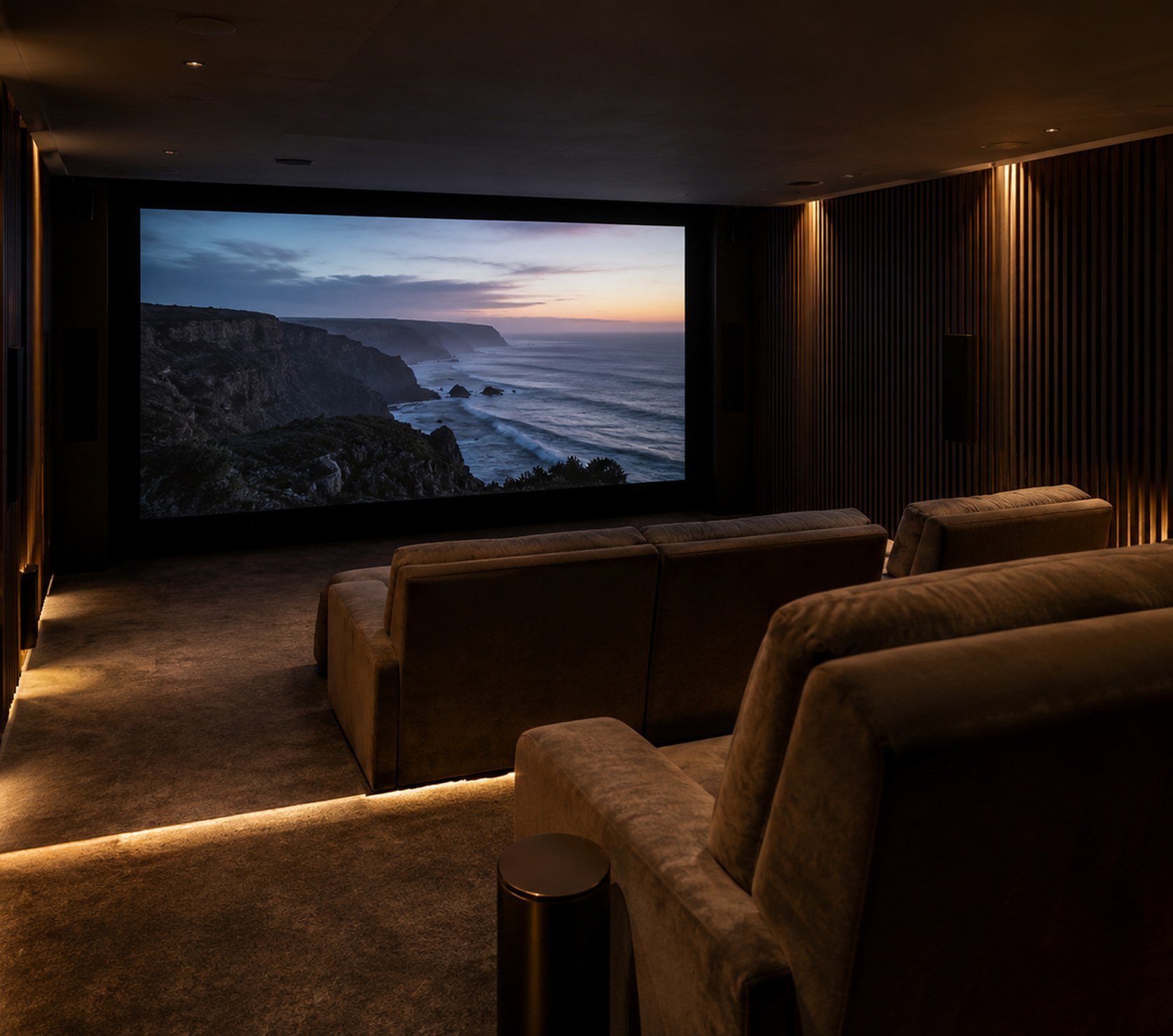 Basement private cinema with a wall-filling screen and two rows of recliners set well back
