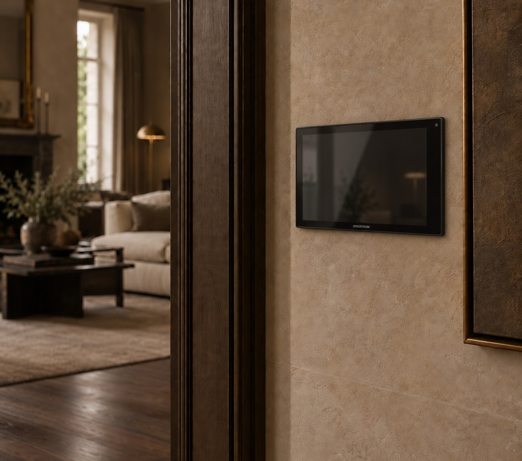 Crestron wall touchscreen beside a doorway in a limestone-plastered hallway