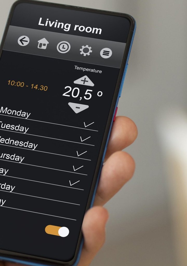 Phone showing a living room heating schedule