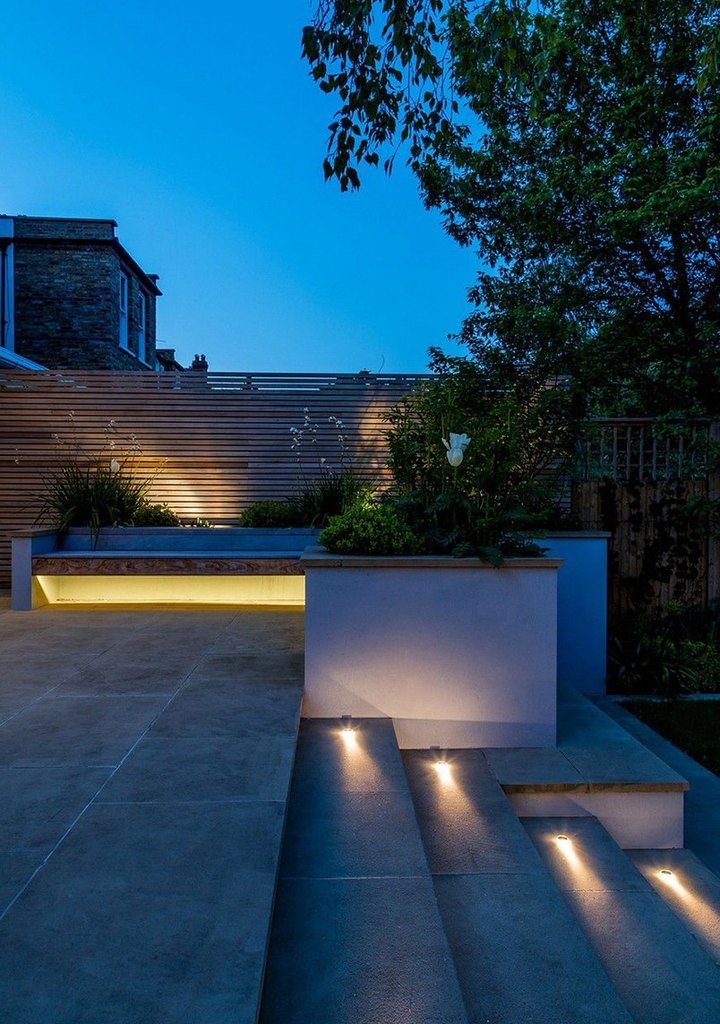 Garden terrace steps with step lights at dusk